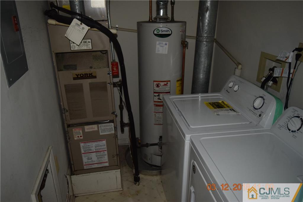 205 Commons Way, Unit 5 East Brunswick, NJ 08816 - Photo 10 of 10 a utility room with dryer and washer