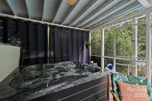 a view of room with wooden floor and outdoor seating