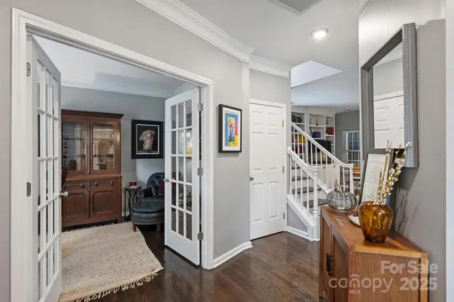 a view of entryway with furniture and wooden floor