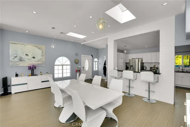 a living room with fireplace furniture and a large window