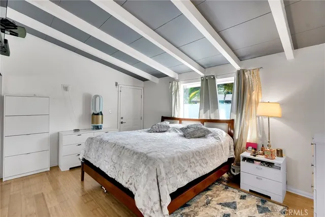 a bedroom with bed and window