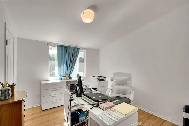 a workspace with furniture and wooden floor