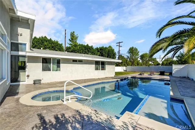 a house view with a backyard space