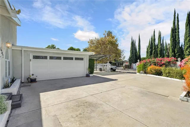 a view of a house with outdoor space and sitting area