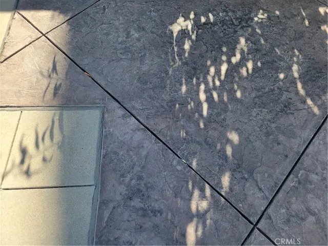 a terrace with a table and chairs