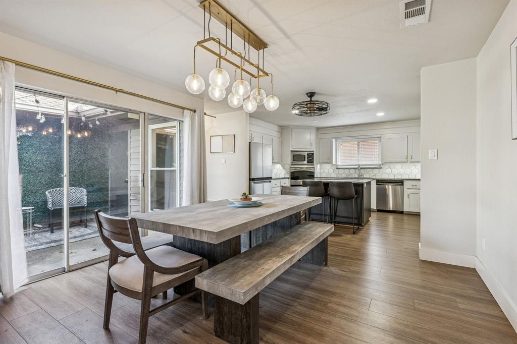 4512 Ranch View Road Fort Worth, TX 76109 - Photo 11 of 40 a view of a dining room with furniture window and wooden floor