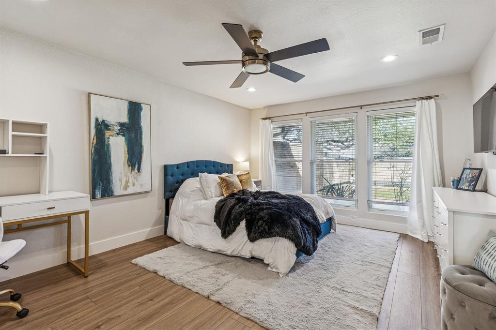 4512 Ranch View Road Fort Worth, TX 76109 - Photo 16 of 40 a bedroom with a large bed and a window