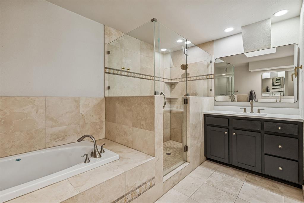 4512 Ranch View Road Fort Worth, TX 76109 - Photo 20 of 40 a bathroom with a tub sink shower and mirror