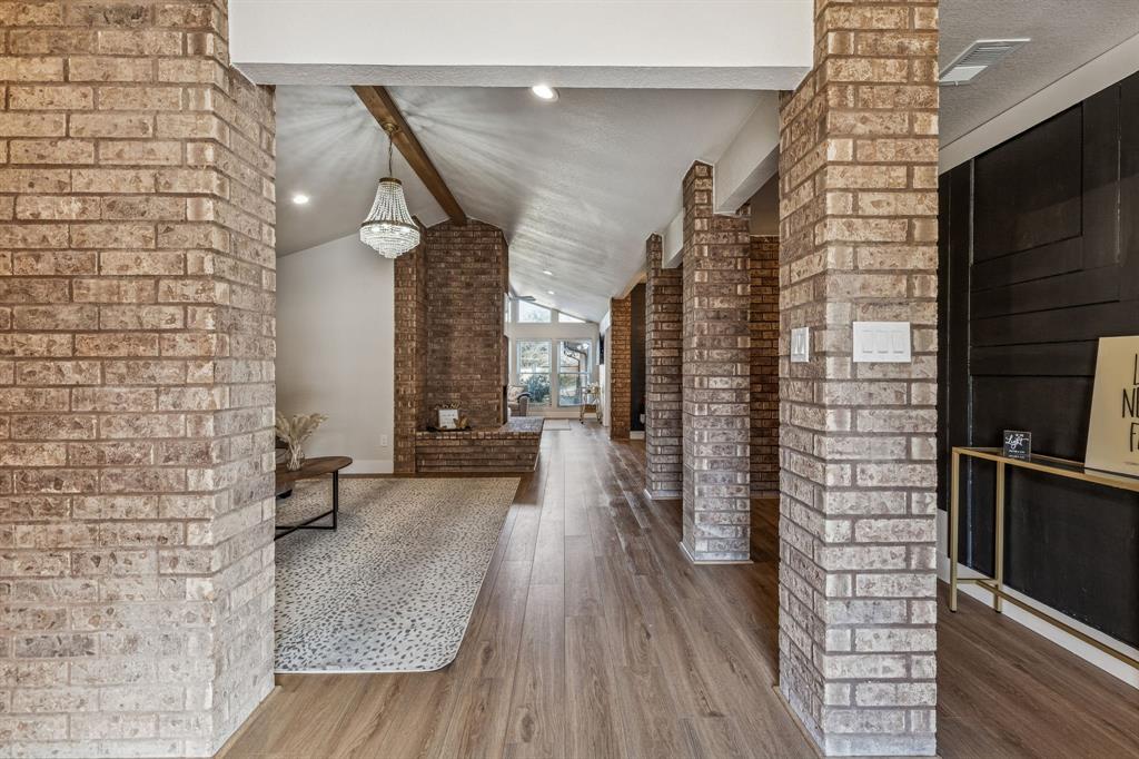 4512 Ranch View Road Fort Worth, TX 76109 - Photo 2 of 40 a view of a hallway with wooden floor and staircase