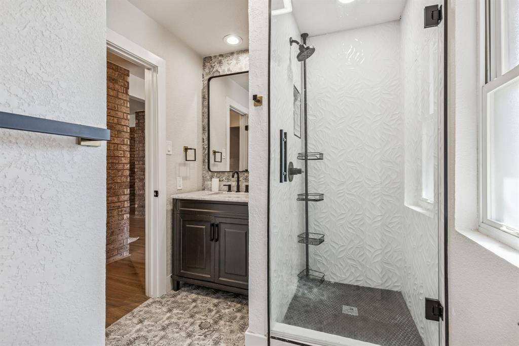 4512 Ranch View Road Fort Worth, TX 76109 - Photo 27 of 40 a bathroom with a shower and a sink
