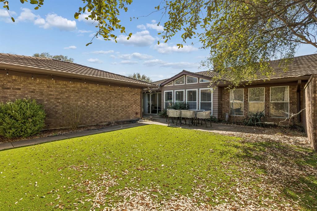 4512 Ranch View Road Fort Worth, TX 76109 - Photo 32 of 40 a front view of a house with a yard