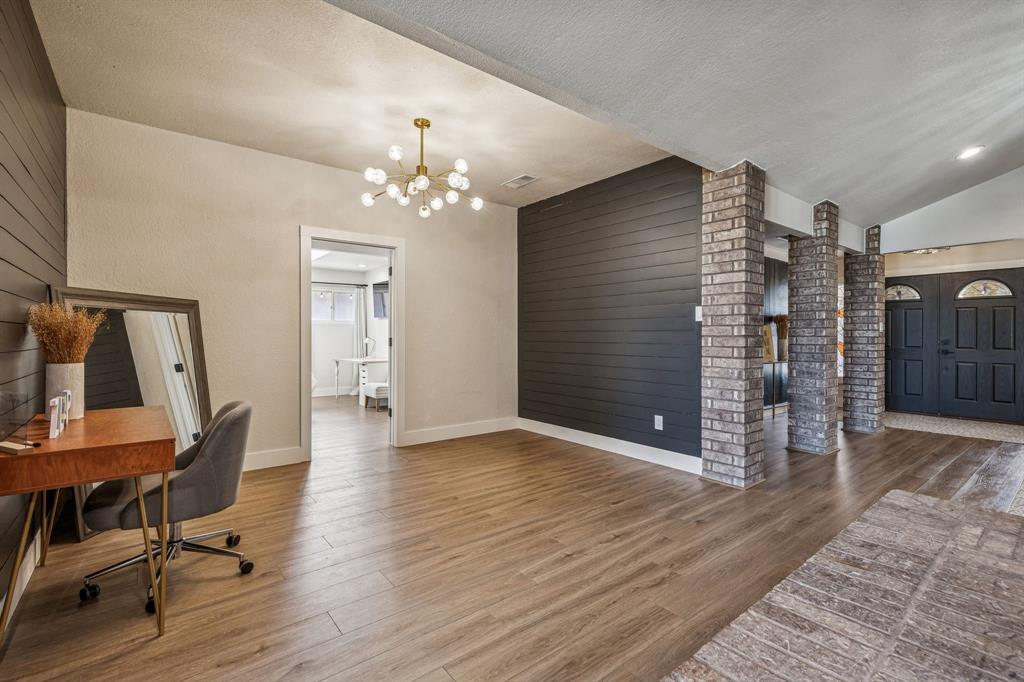 4512 Ranch View Road Fort Worth, TX 76109 - Photo 4 of 40 a view of a livingroom with wooden floor and stairs