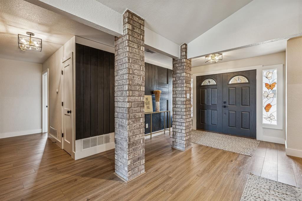 4512 Ranch View Road Fort Worth, TX 76109 - Photo 5 of 40 a view of a hallway with wooden floor