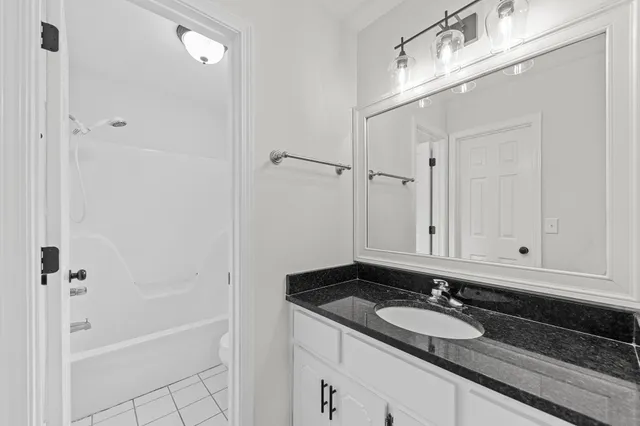 a bathroom with a toilet and bathtub