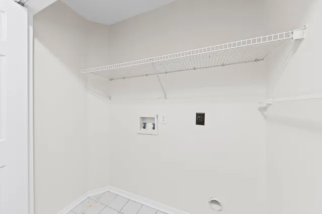 a view of a brick house with a backyard