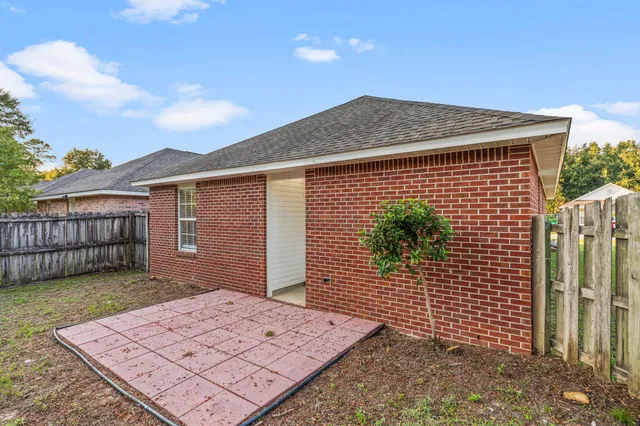 an aerial view of a house with a garden