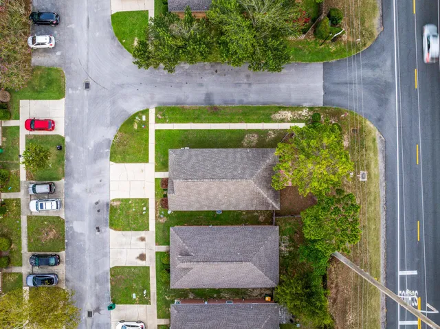 an aerial view of residential houses with outdoor space
