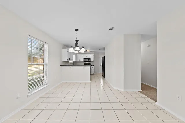 a view of kitchen with windows