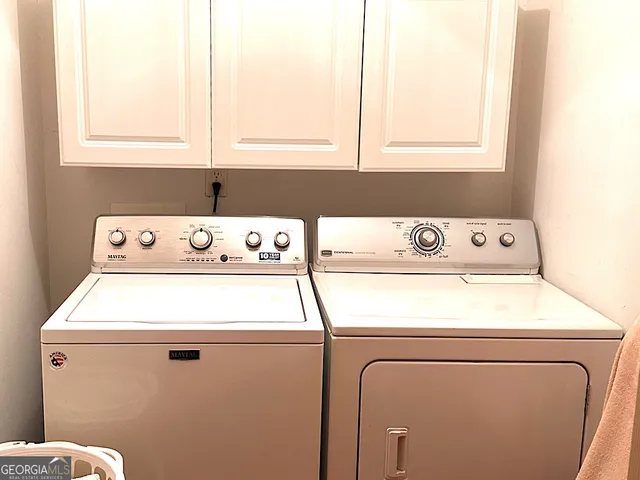 a view of a chairs and table on the deck