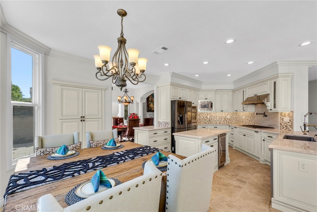 25672 Raintree Road Laguna Hills, CA 92653 - Photo 14 of 50 a kitchen that has a lot of cabinets in it