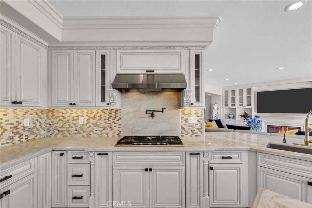 25672 Raintree Road Laguna Hills, CA 92653 - Photo 19 of 50 a kitchen with stainless steel appliances granite countertop a sink stove and cabinets