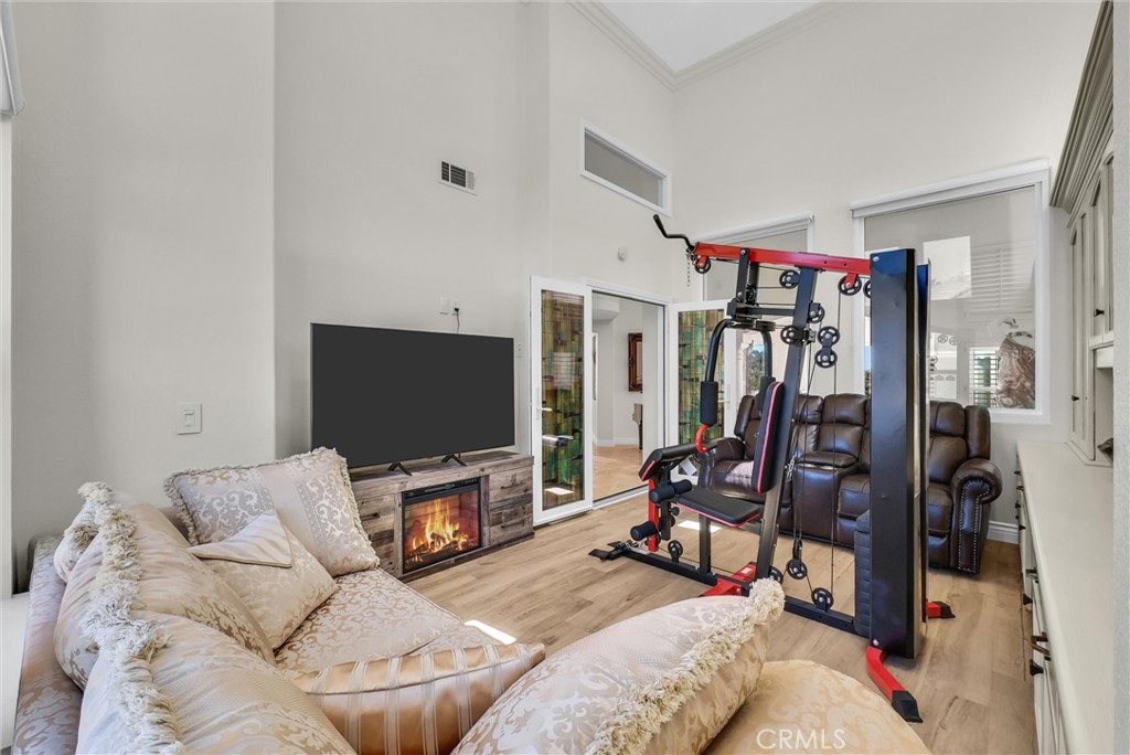 25672 Raintree Road Laguna Hills, CA 92653 - Photo 20 of 50 a living room with furniture and a flat screen tv