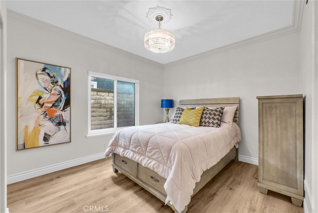 25672 Raintree Road Laguna Hills, CA 92653 - Photo 22 of 50 a bedroom with a bed and a window