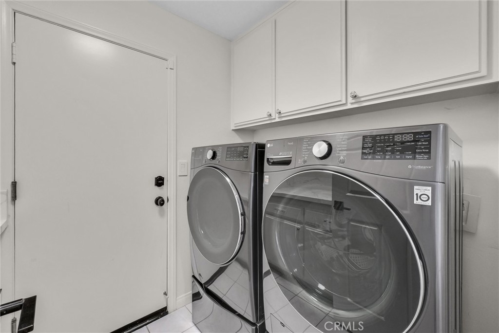 25672 Raintree Road Laguna Hills, CA 92653 - Photo 25 of 50 a utility room with dryer and washer