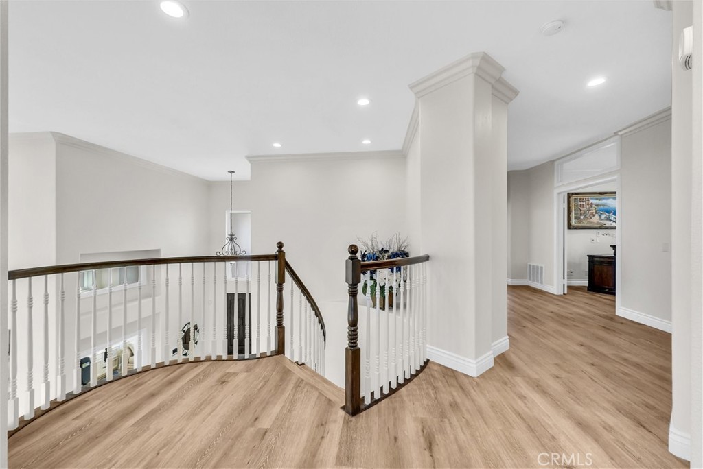 25672 Raintree Road Laguna Hills, CA 92653 - Photo 26 of 50 a view of a hallway with wooden floor and stairs