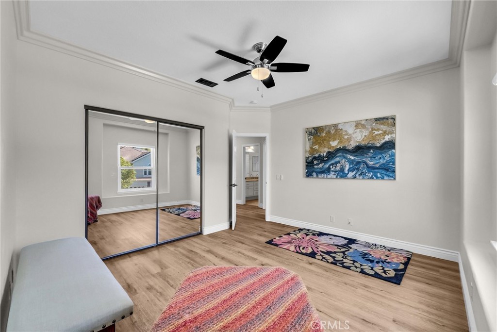 25672 Raintree Road Laguna Hills, CA 92653 - Photo 40 of 50 a bedroom with bed and glass door