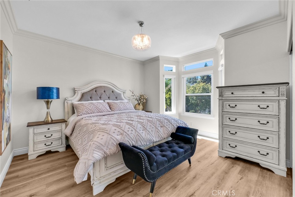 25672 Raintree Road Laguna Hills, CA 92653 - Photo 41 of 50 a bedroom with a bed a couch and window