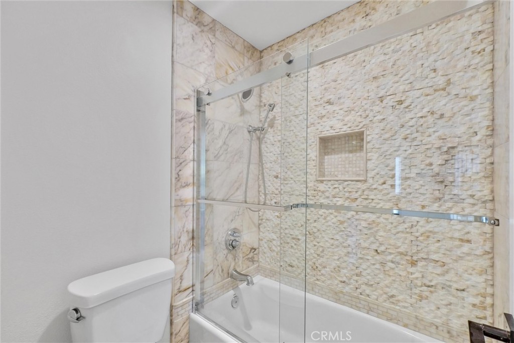 25672 Raintree Road Laguna Hills, CA 92653 - Photo 43 of 50 a bathroom with a shower and a toilet