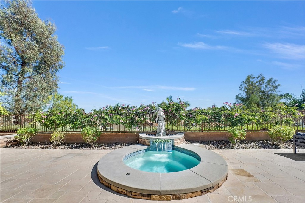 25672 Raintree Road Laguna Hills, CA 92653 - Photo 44 of 50 a view of a swimming pool with a yard