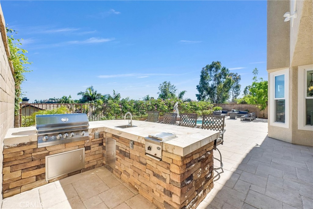 25672 Raintree Road Laguna Hills, CA 92653 - Photo 48 of 50 a view of a terrace with chairs and potted plants