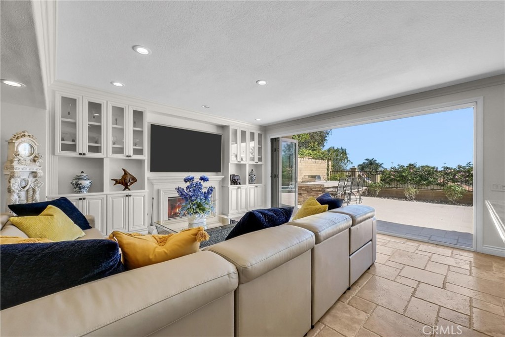 25672 Raintree Road Laguna Hills, CA 92653 - Photo 10 of 50 a living room with furniture and a flat screen tv