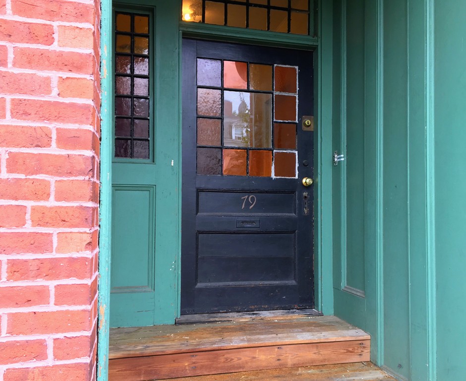 a view of entry way with wooden door