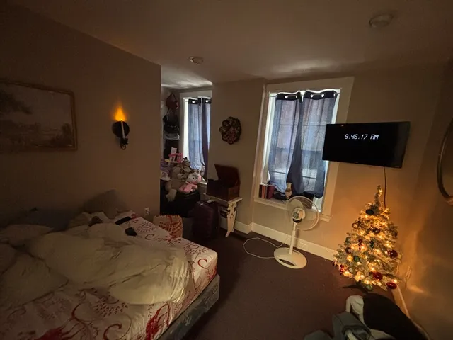 a bed room with furniture and a window