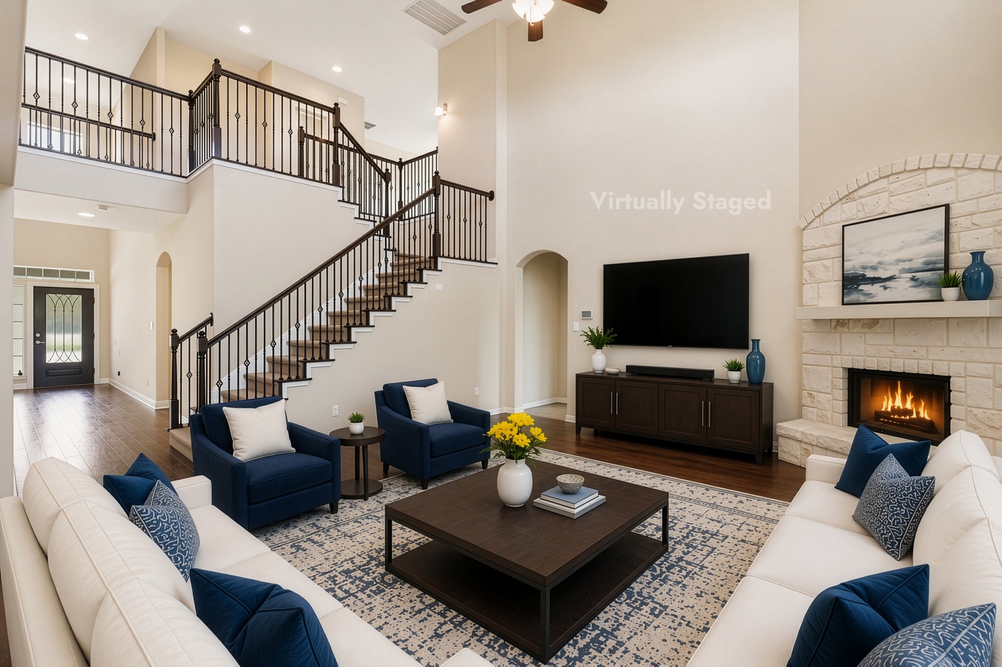 1511 Rimstone Drive Cedar Park, TX 78613 - Photo 13 of 39 AI Staging furnished. A striking dual staircase with elegant iron balusters frames this generously sized living area featuring a cozy fireplace.