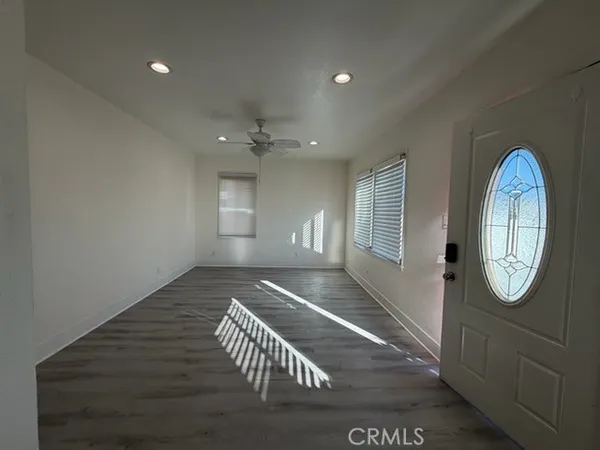 a view of an entryway with wooden floor