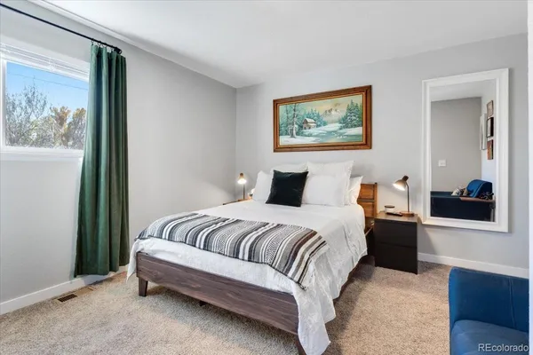 a bedroom with a bed and a view of bathroom