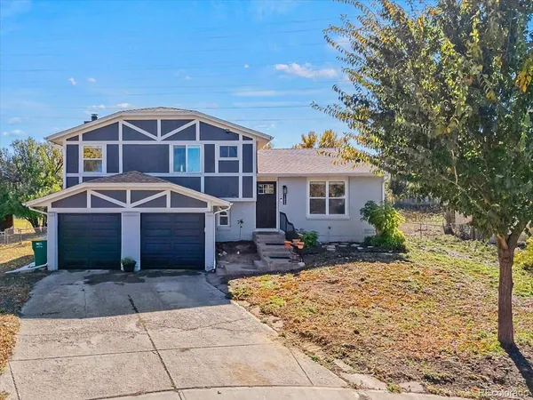 a front view of a house with yard