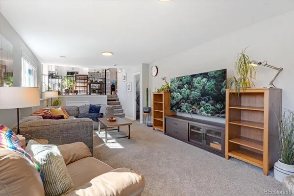 a living room with furniture and a large window