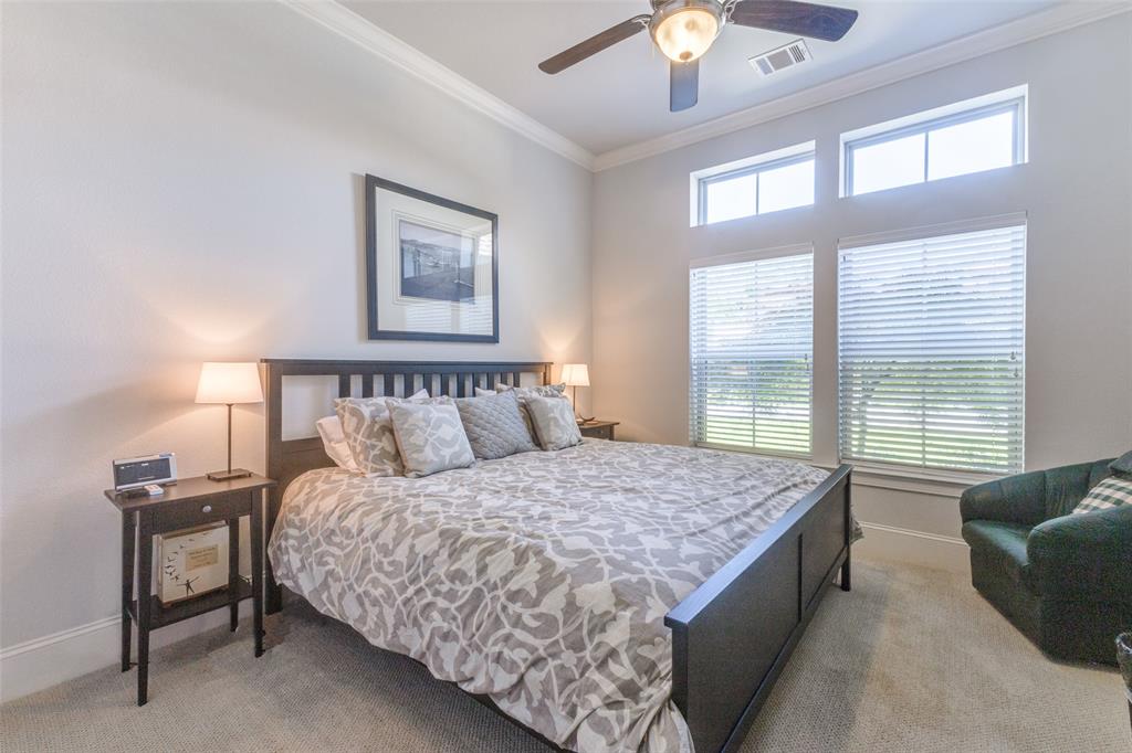 4008 North Cresthaven Road Dallas, TX 75209 - Photo 17 of 37 a bedroom with a large bed and a couch