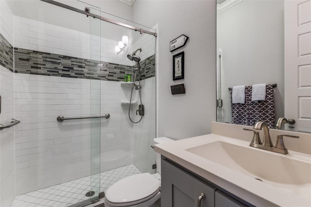 4008 North Cresthaven Road Dallas, TX 75209 - Photo 18 of 37 a bathroom with a sink toilet and shower