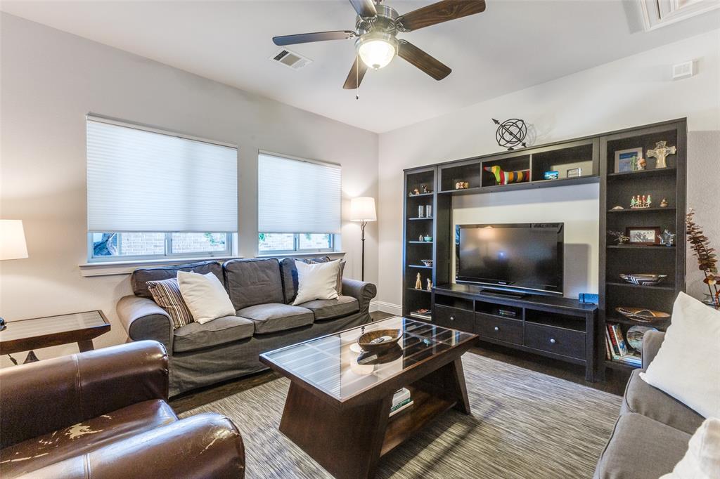 4008 North Cresthaven Road Dallas, TX 75209 - Photo 23 of 37 a living room with furniture and a flat screen tv