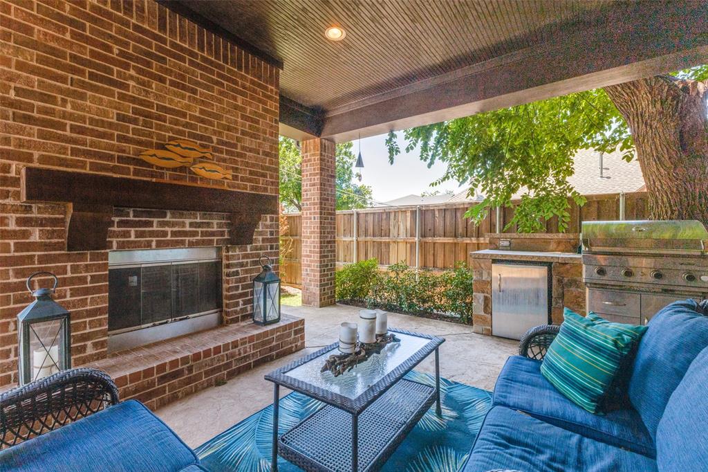 4008 North Cresthaven Road Dallas, TX 75209 - Photo 31 of 37 a outdoor living space with patio furniture and a fireplace