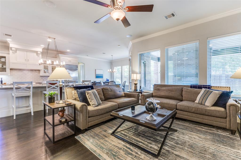 4008 North Cresthaven Road Dallas, TX 75209 - Photo 6 of 37 a living room with furniture a rug and a chandelier