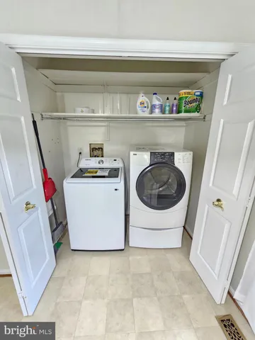 a kitchen with stainless steel appliances a stove a sink and a refrigerator