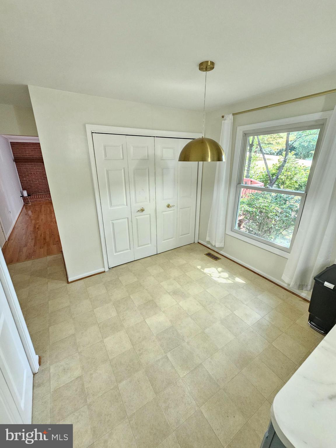 11321 Classical Lane Silver Spring, MD 20901 - Photo 13 of 66 a view of an empty room with glass door