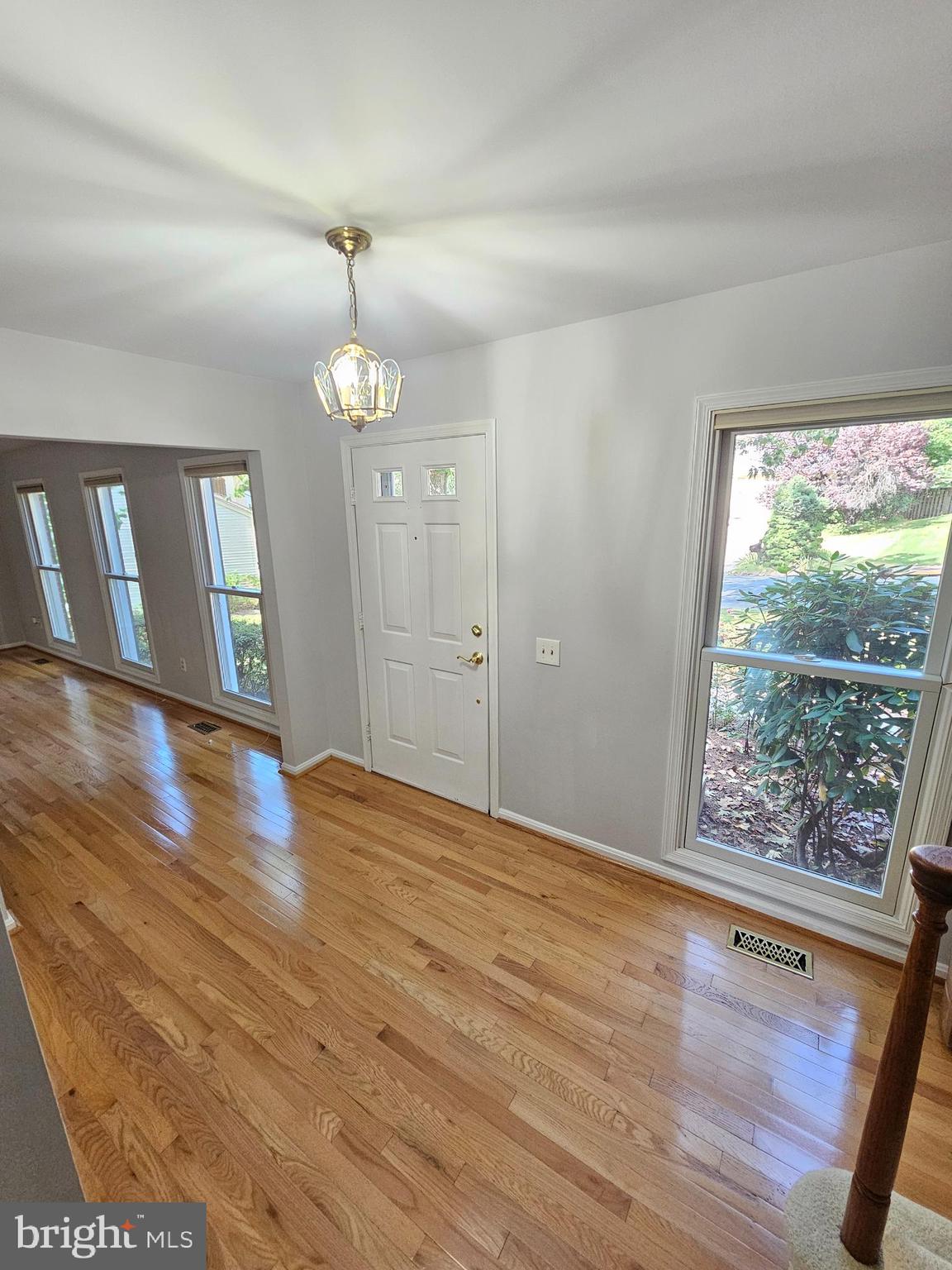 11321 Classical Lane Silver Spring, MD 20901 - Photo 2 of 66 a view of an empty room with wooden floor and fan
